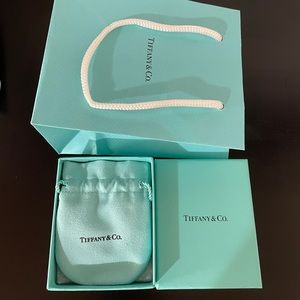 Tiffany & Co box; bag; and jewelry bag.
